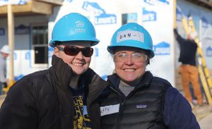 Two KraftCPAs employees volunteering at a Habitat for Humanity build