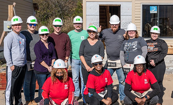 We don't mind getting our hands dirty for a good cause, including at our Habitat for Humanity builds.